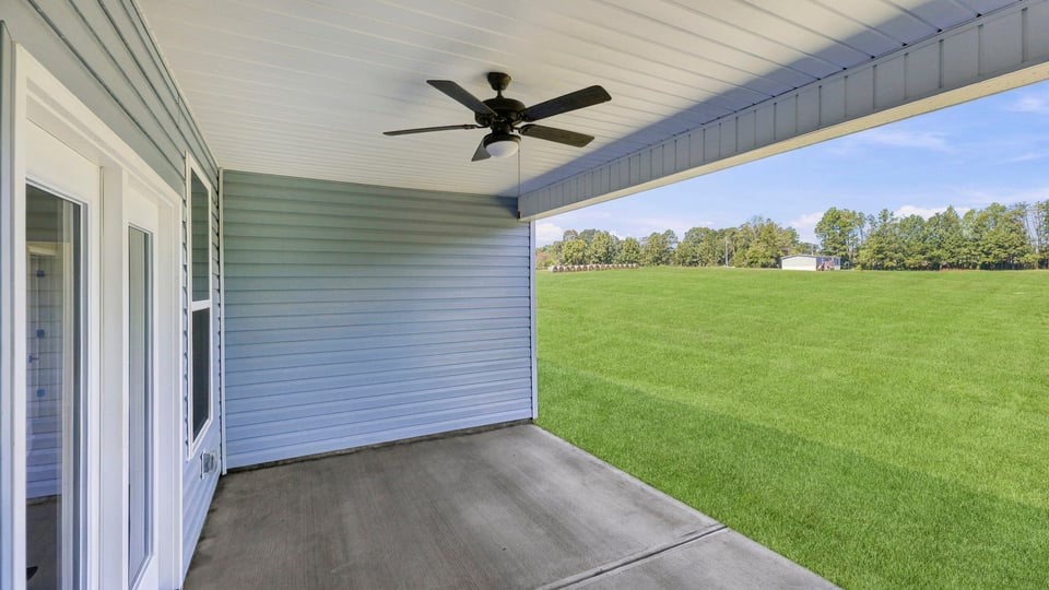 Back exterior with large backyard.