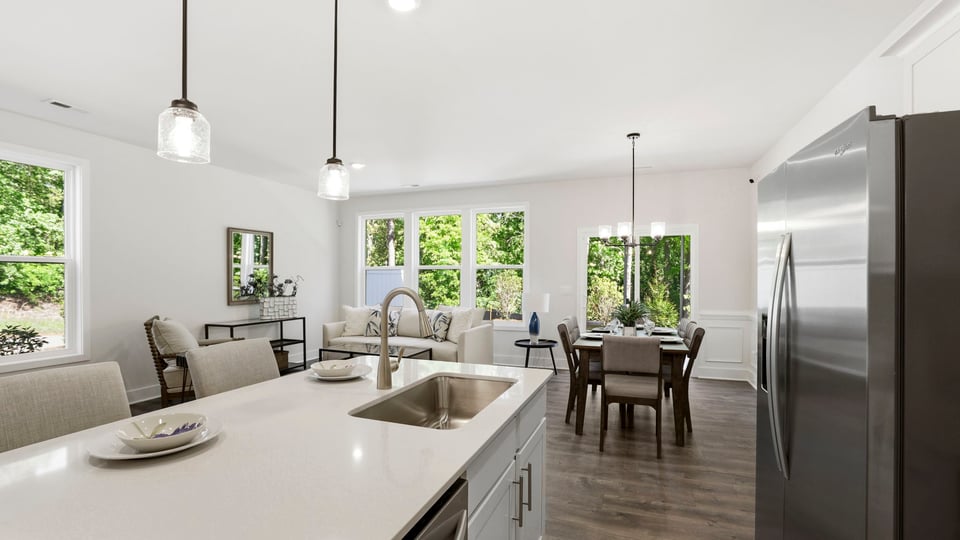 Kitchen with quartz countertops and stainless steel appliances.