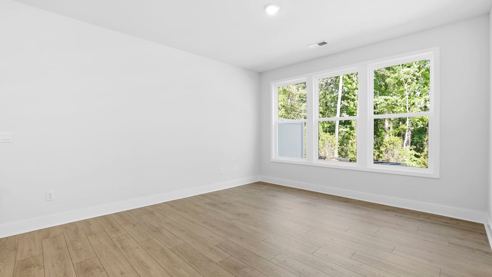 Kitchen and island with quartz countertops and stainless steel appliances.