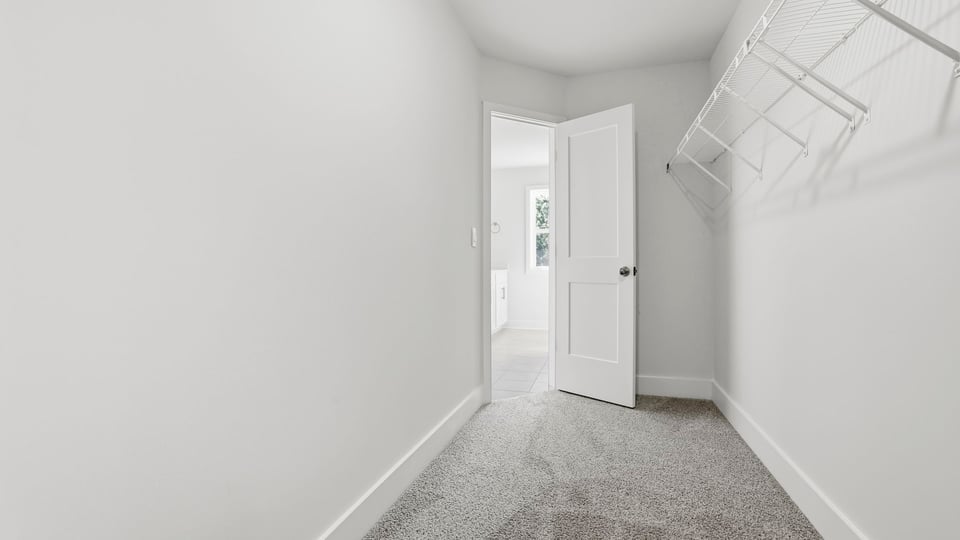 Closet with hanging storage racks.
