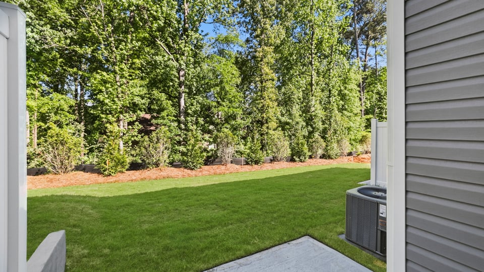 Back exterior of home with pato.