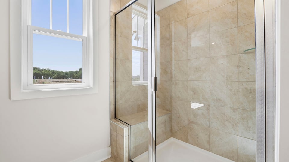 Bathroom with walk in shower.