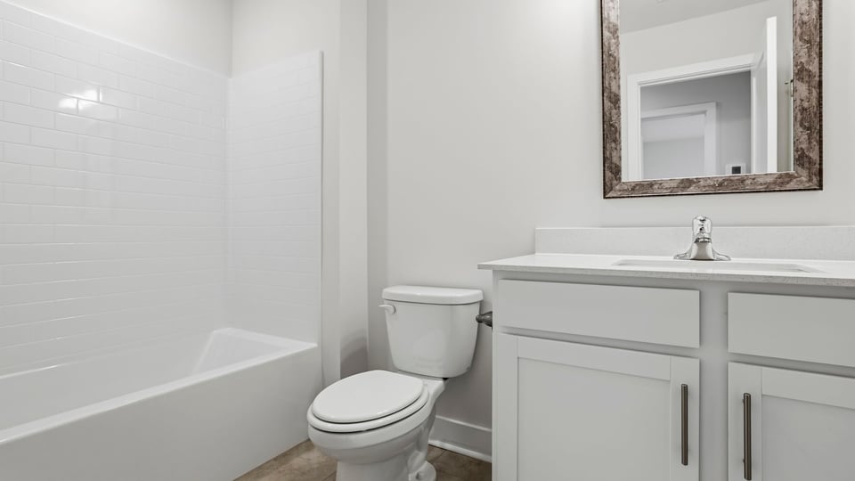 Bathroom with vanity and tub.