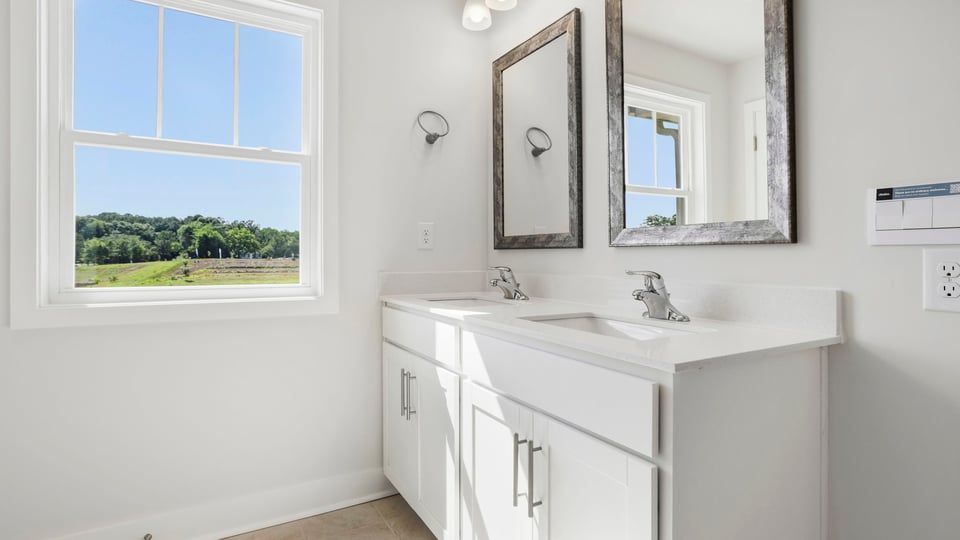 Bathroom with vanity and window.