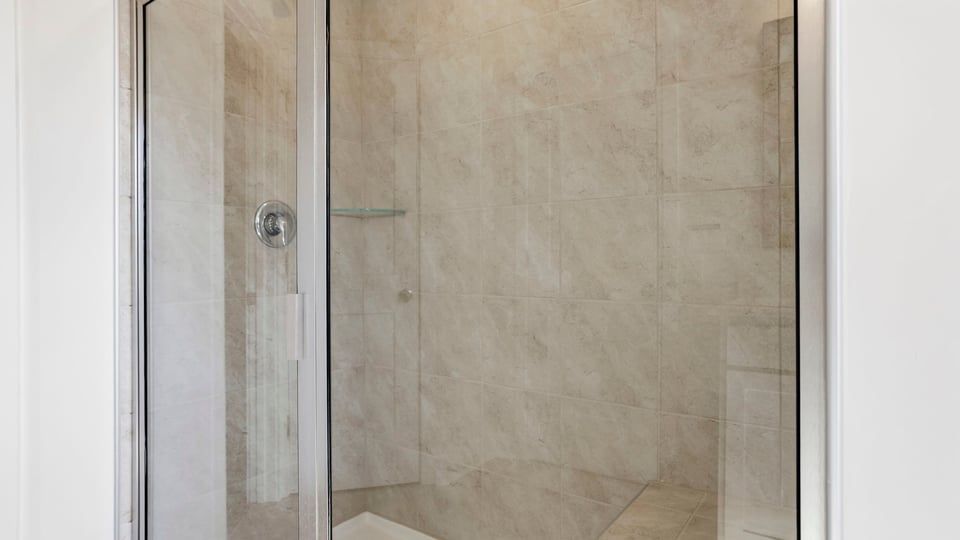 Bathroom with walk in shower.
