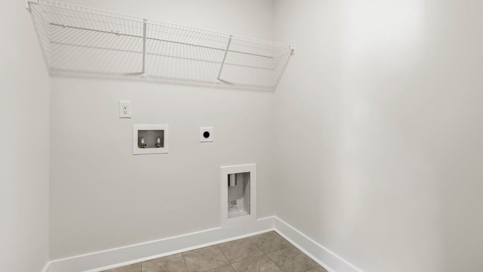 Laundry room with hanigng storage racks.