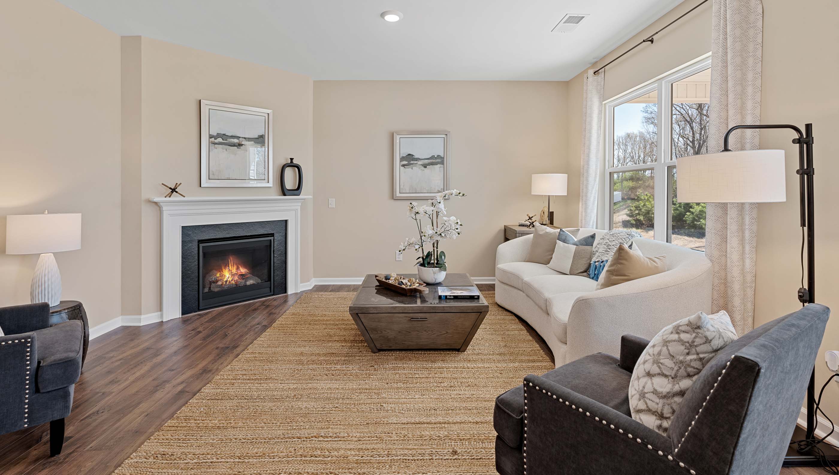 Living room with windows and fireplace.