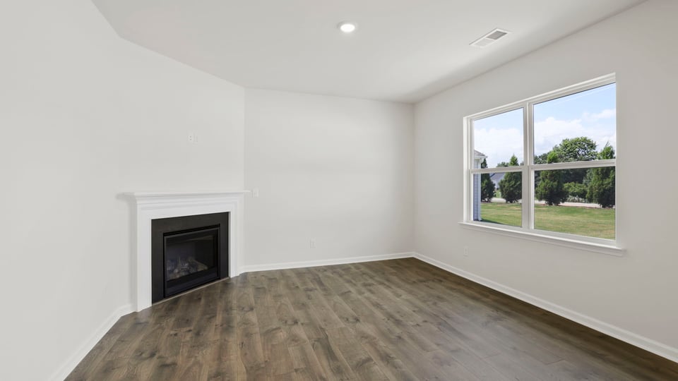 Living area with windows and fireplace.