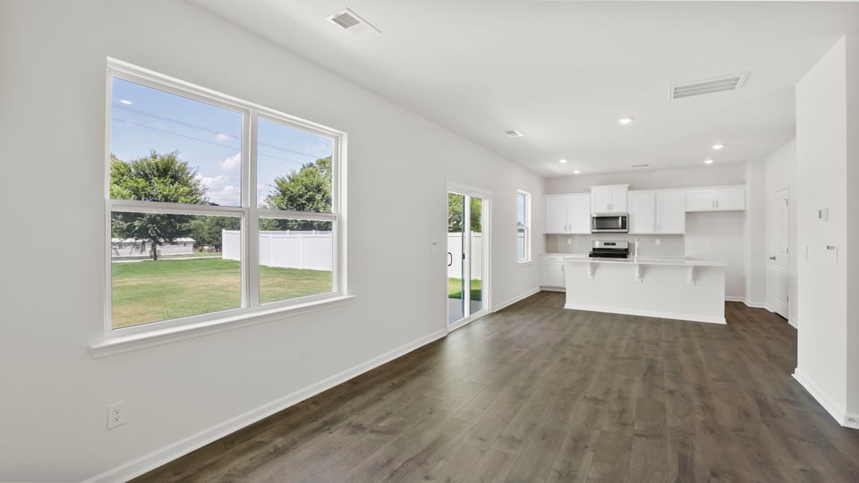 Living area with windows and fireplace.