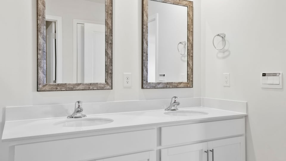 Primary bathroom with double vanity sinks.