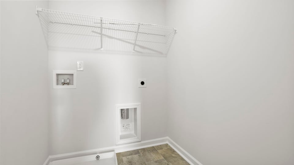 Laundry room with shelf.