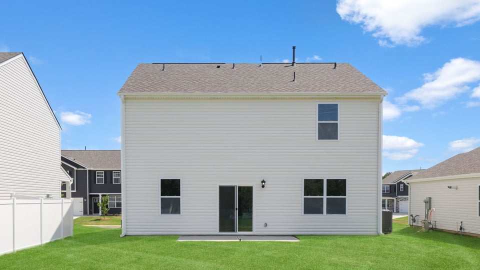 Back exterior with large backyard.
