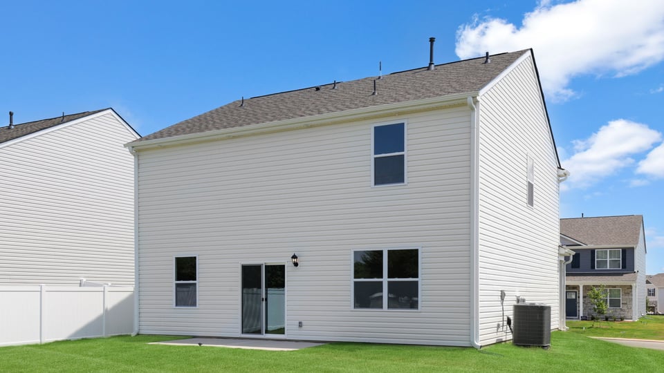 Back exterior with large backyard.