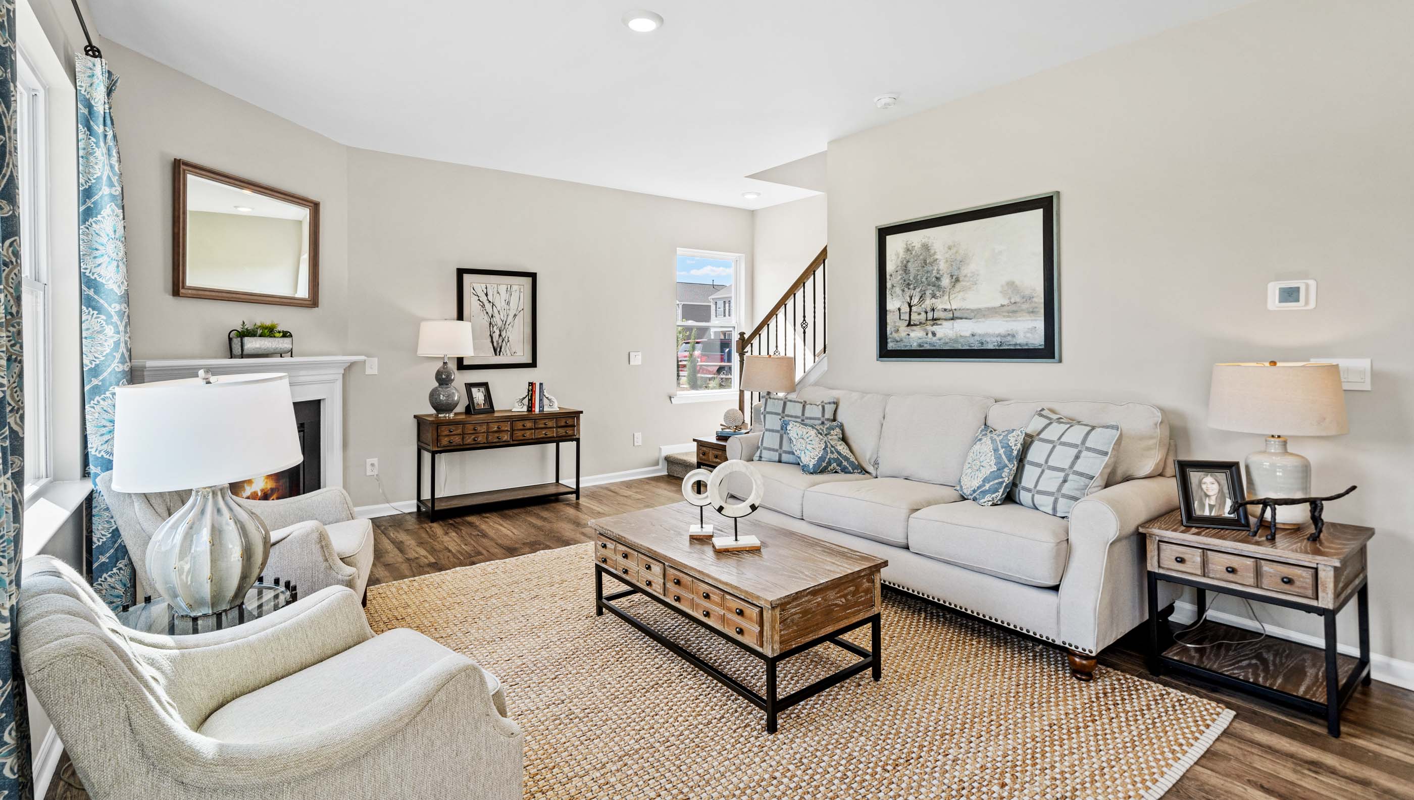Living room with windows and fireplace.