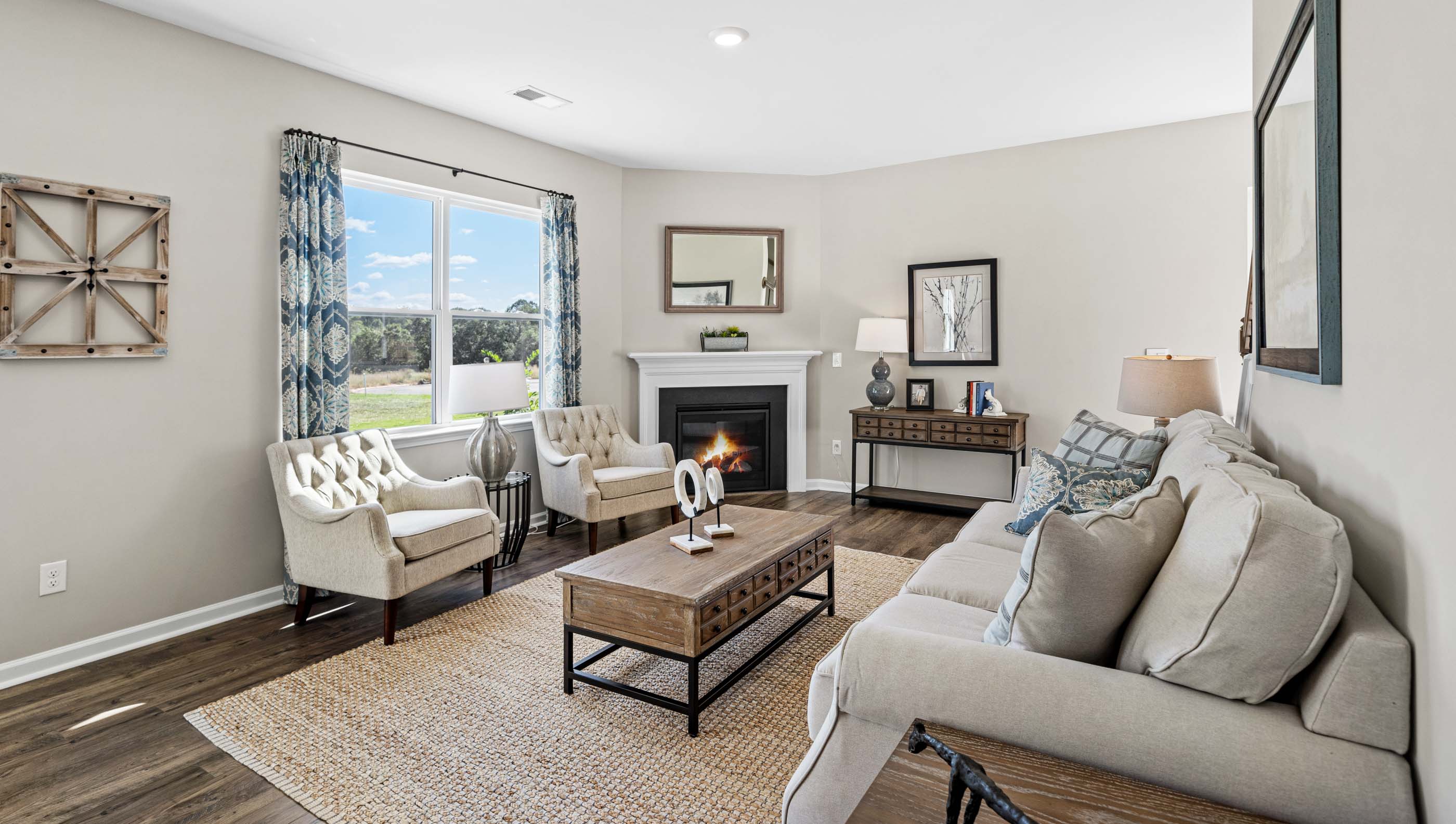 Living room with windows and fireplace.