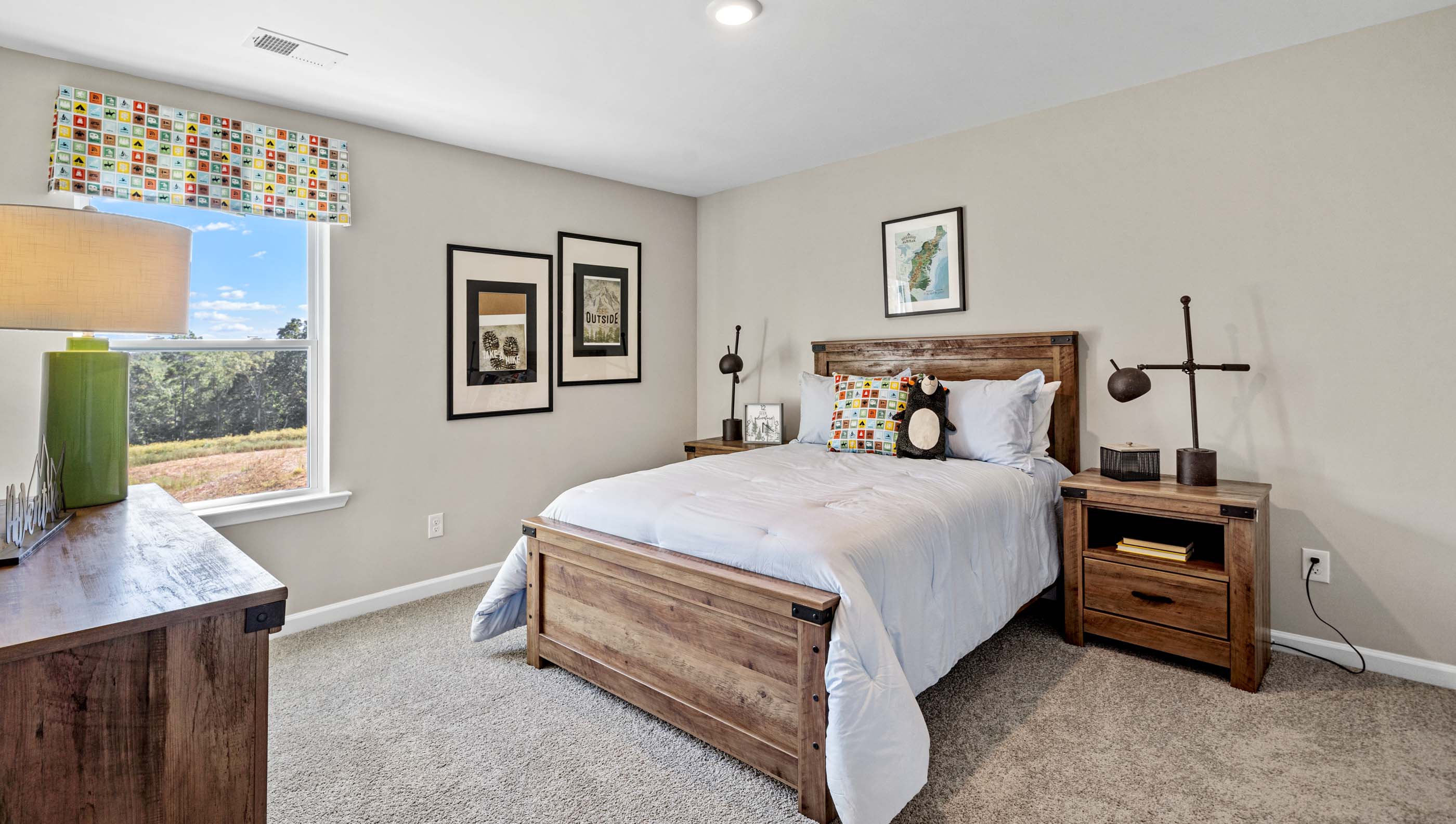 Bedroom with windows and carpet.