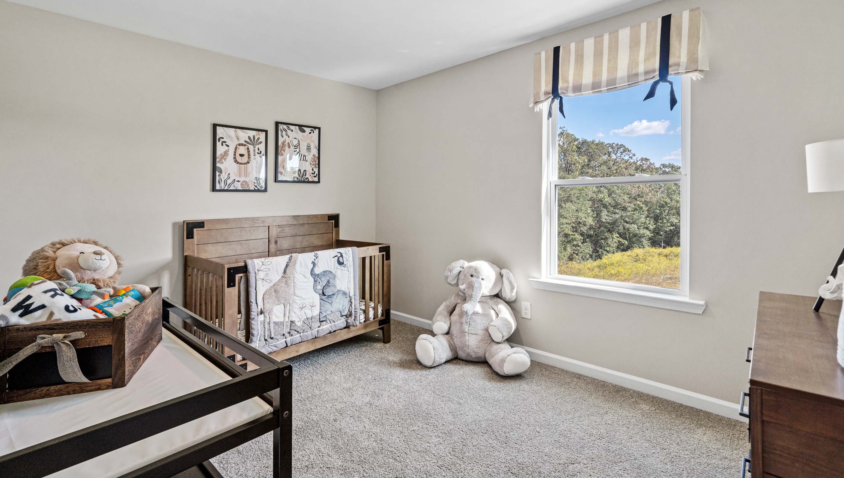 Bedroom with windows and carpet.