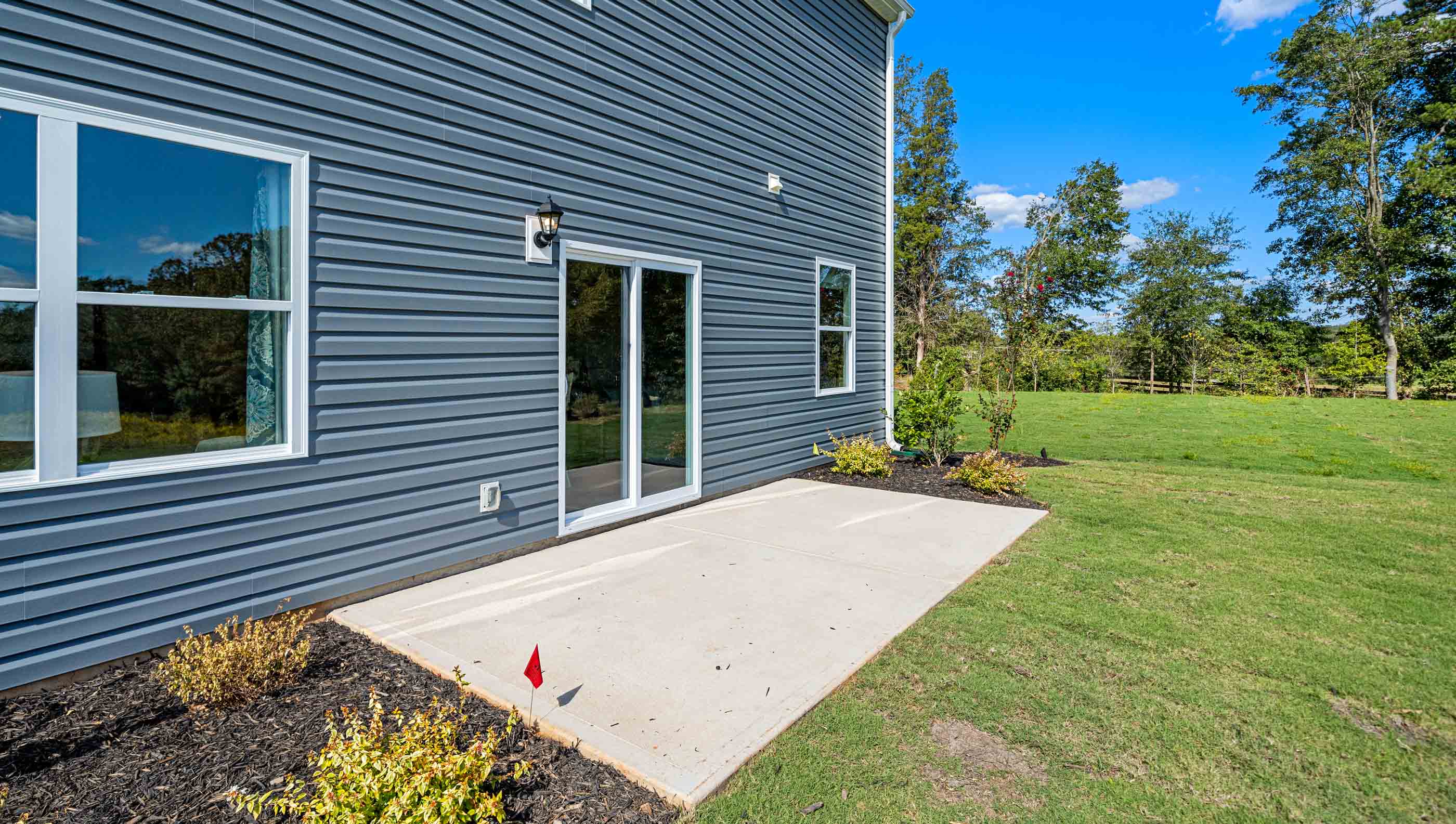 Back exterior with large backyard.