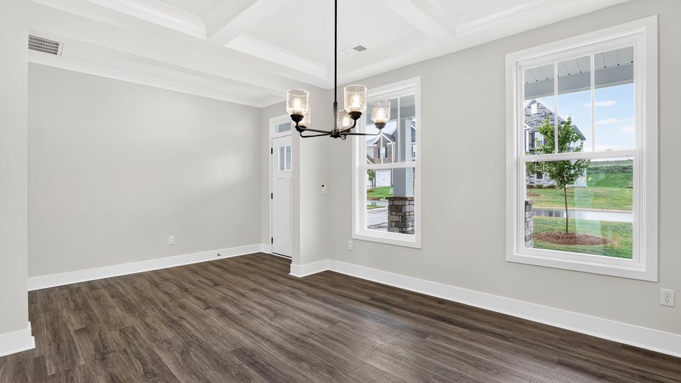 Living area with fireplace and windows.