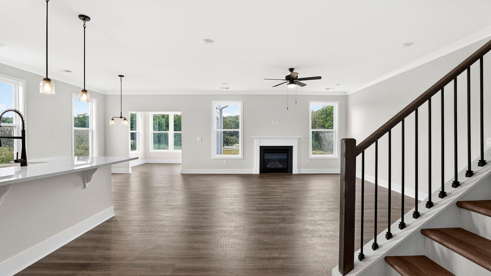Living area with fireplace and windows.