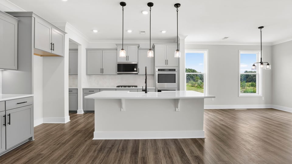 Kitchen with island and cabinets.