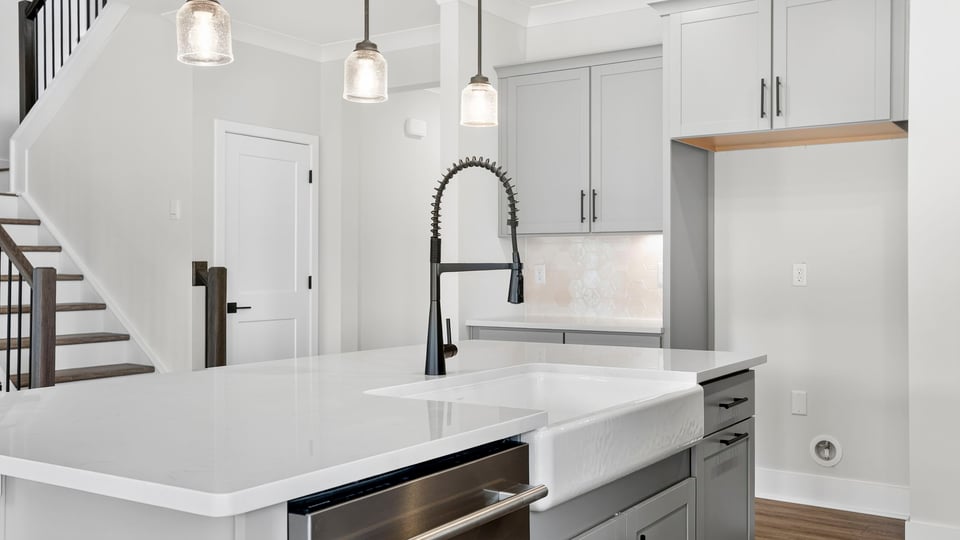 Kitchen with island and cabinets.