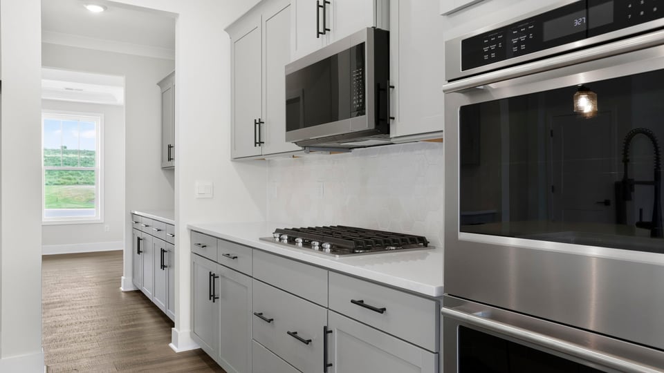Kitchen with island and cabinets.