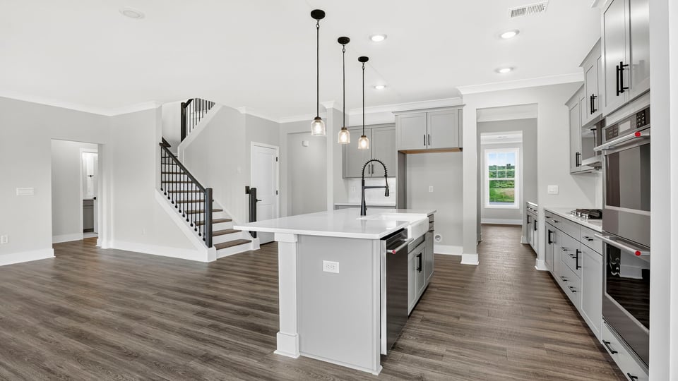 Kitchen with island and cabinets.