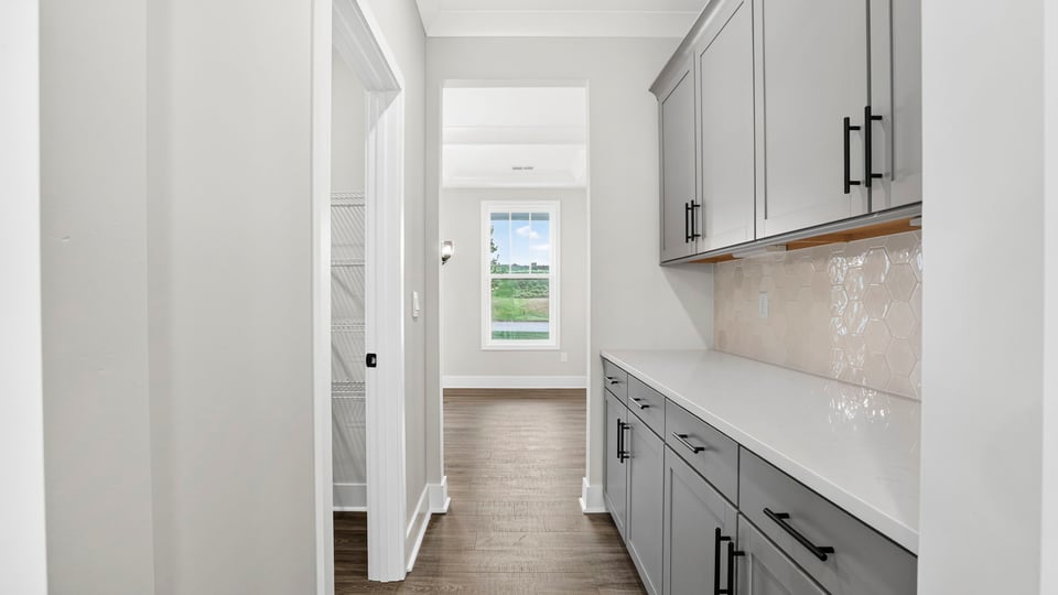 Kitchen with island and cabinets.