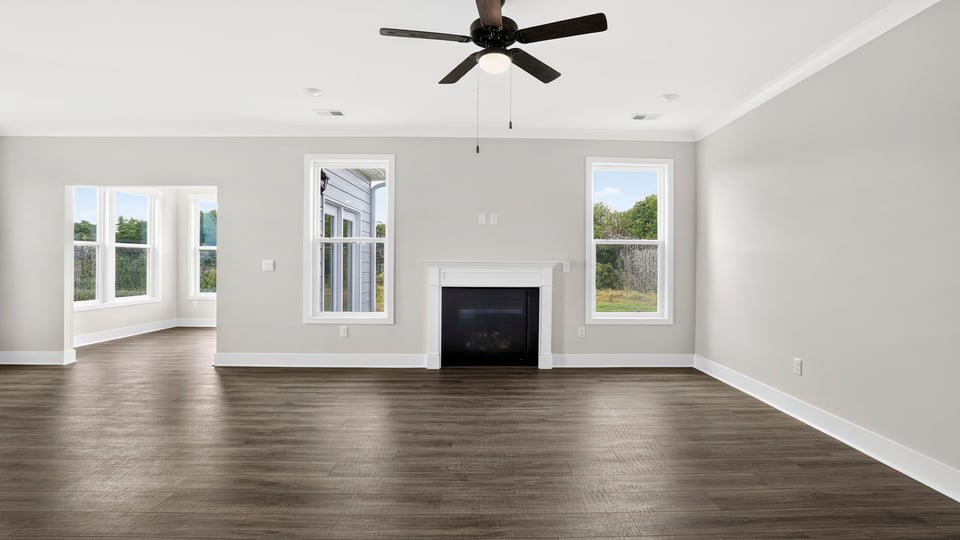 Living area with fireplace and windows.