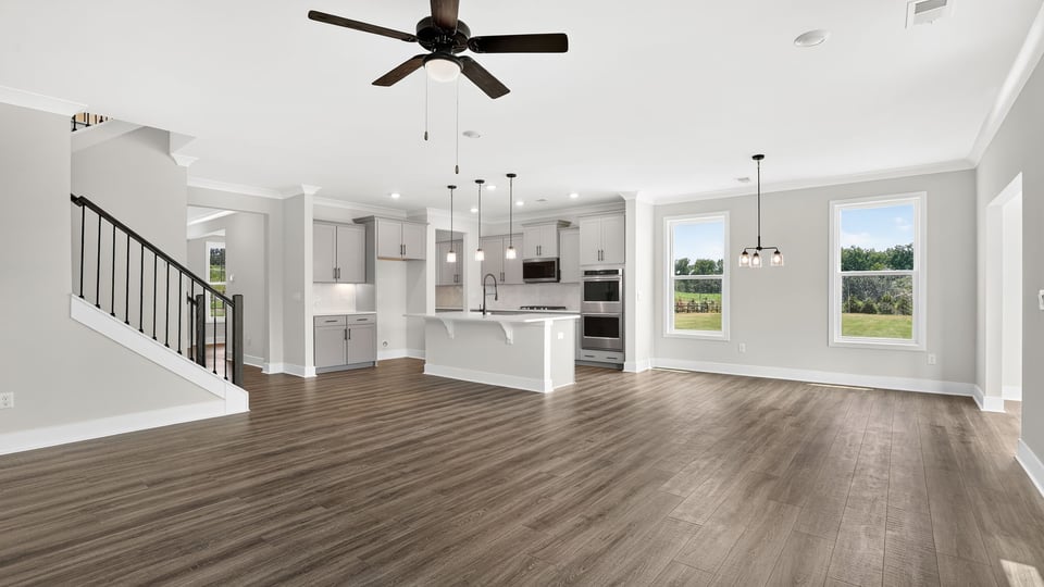 Living area with fireplace and windows.