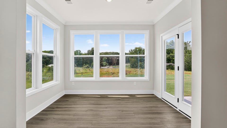 Living area with fireplace and windows.