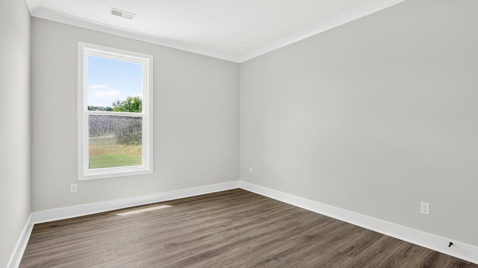 Bedroom with window and closet.
