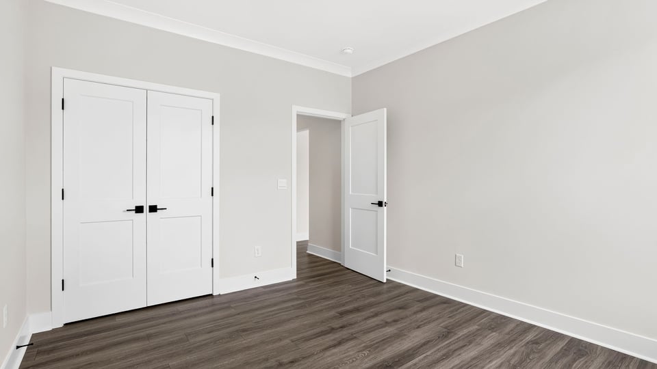 Bedroom with window and closet.