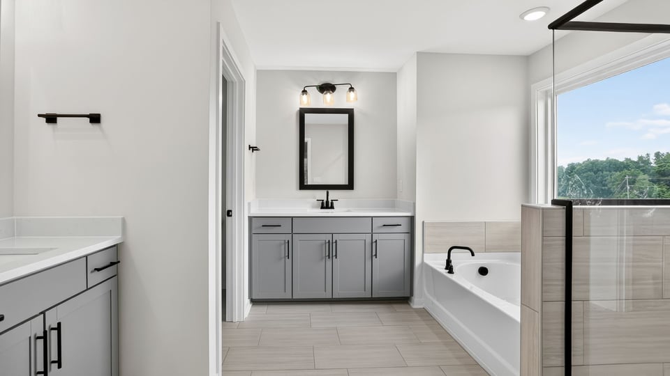 Primary bathroom with double vanity sinks.