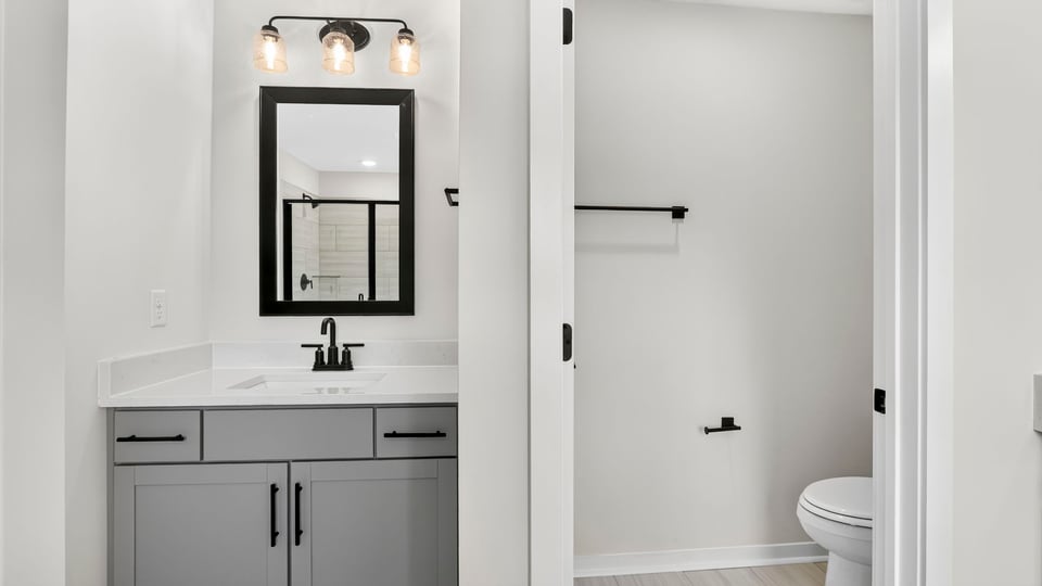 Primary bathroom with double vanity sinks.