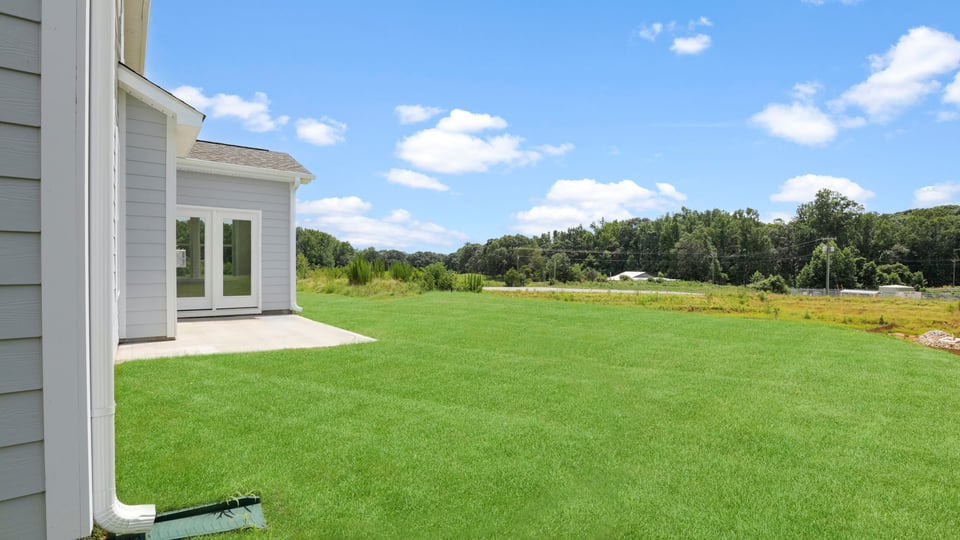 Back exterior with large backyards.