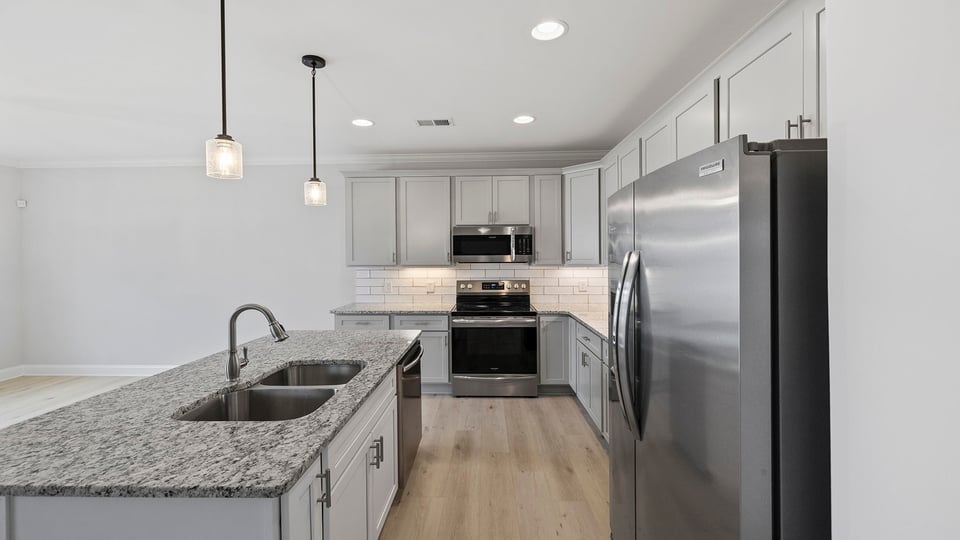 Kitchen with island and cabinets.