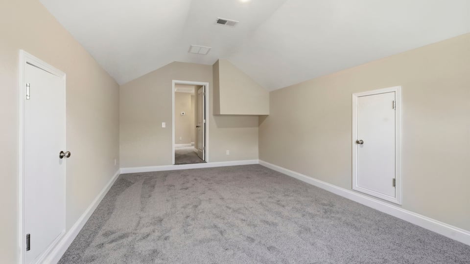 Bedroom with carpet and window.