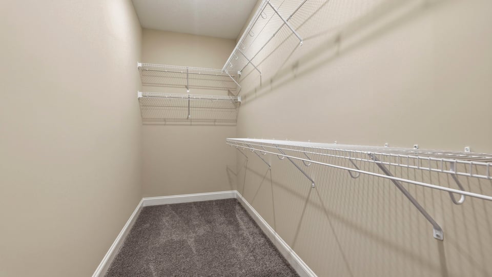 Closet with hanging storage racks.