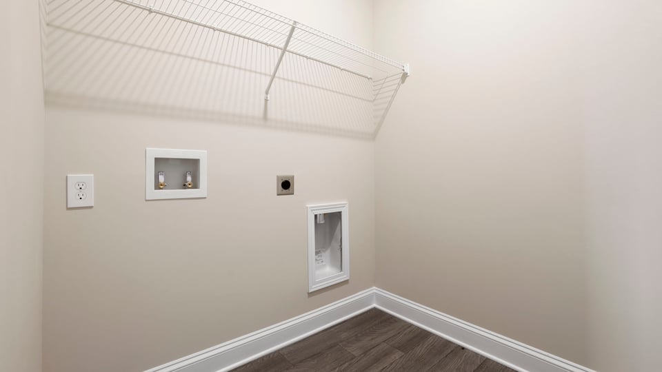 Laundry room with hanging storage racks.