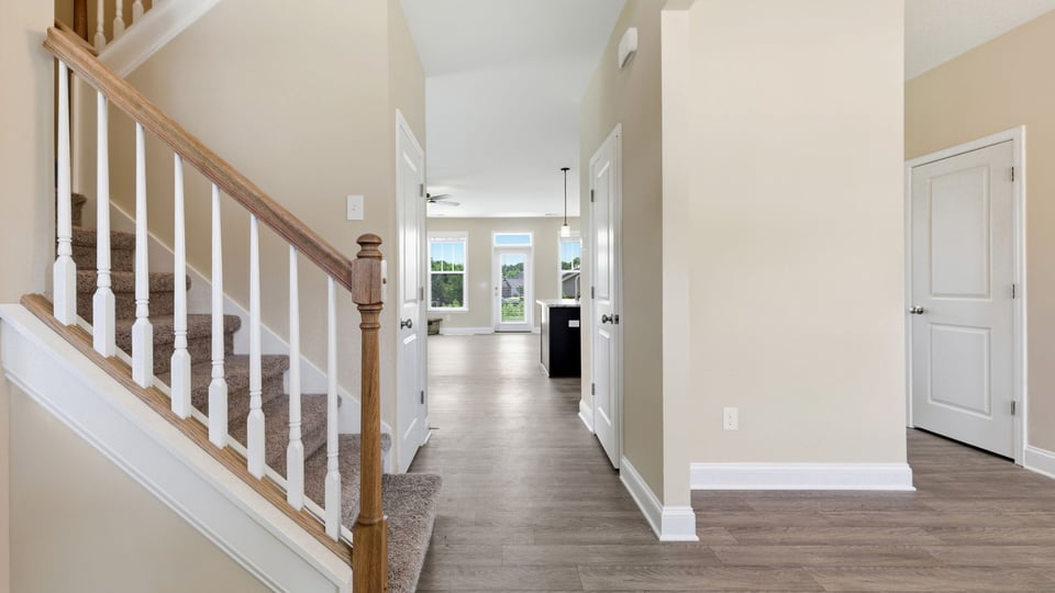 Halwlay into home with view of stairs.