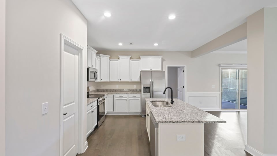 View of kitchen and door to the outside.
