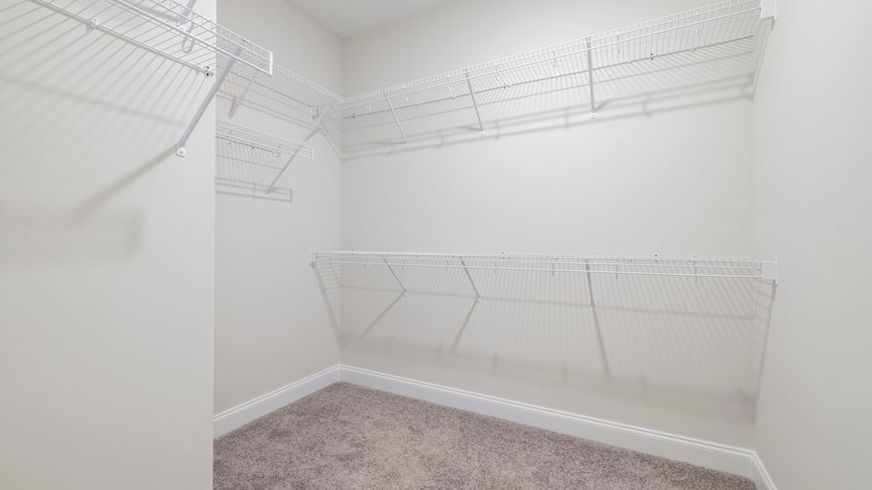 Primary bedroom walk-in closet.