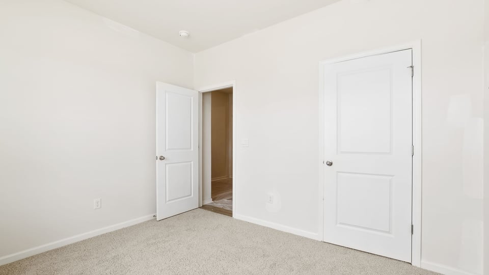 Bedroom with carpet.