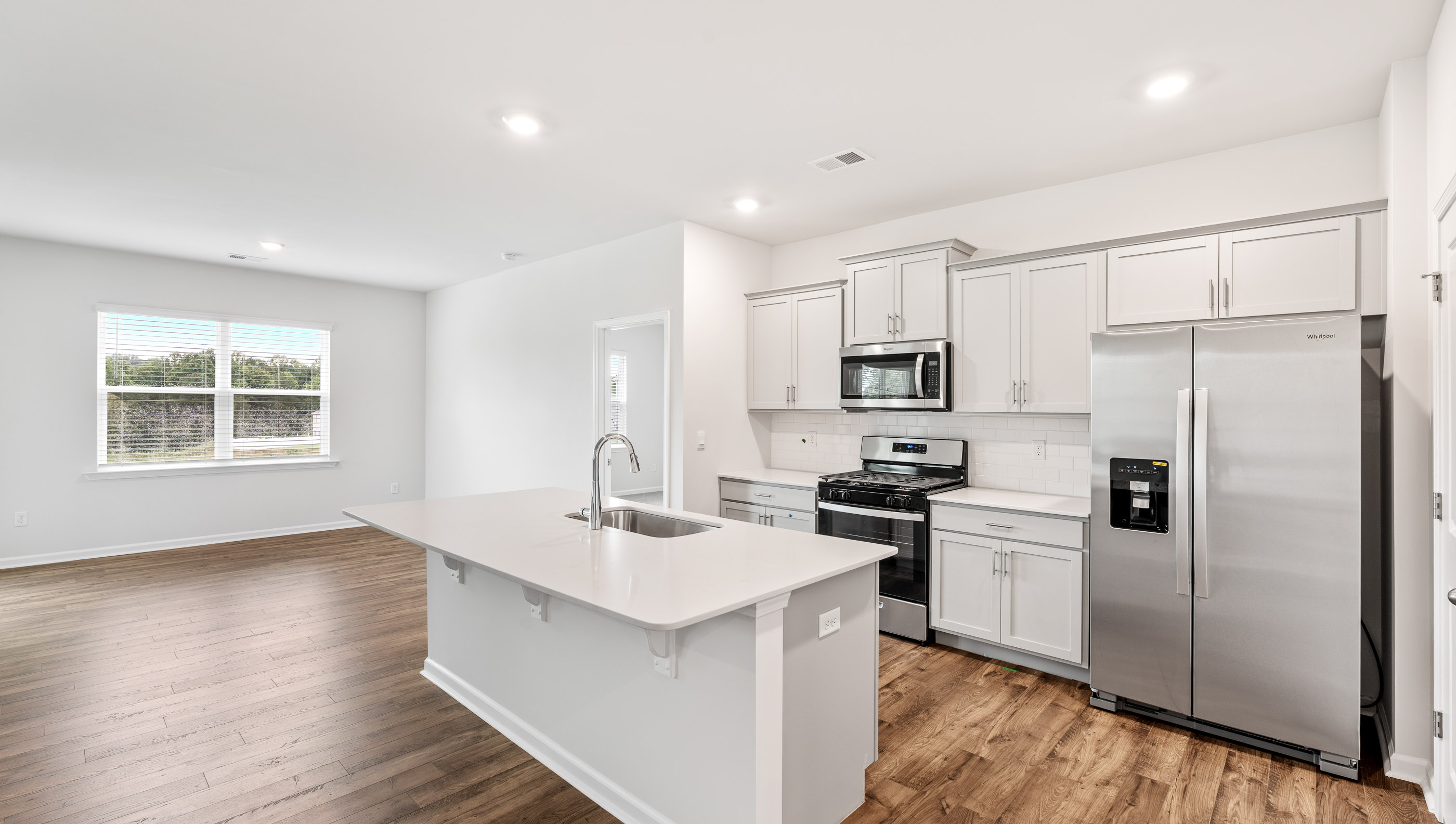Kitchen features stainless steel appliances.