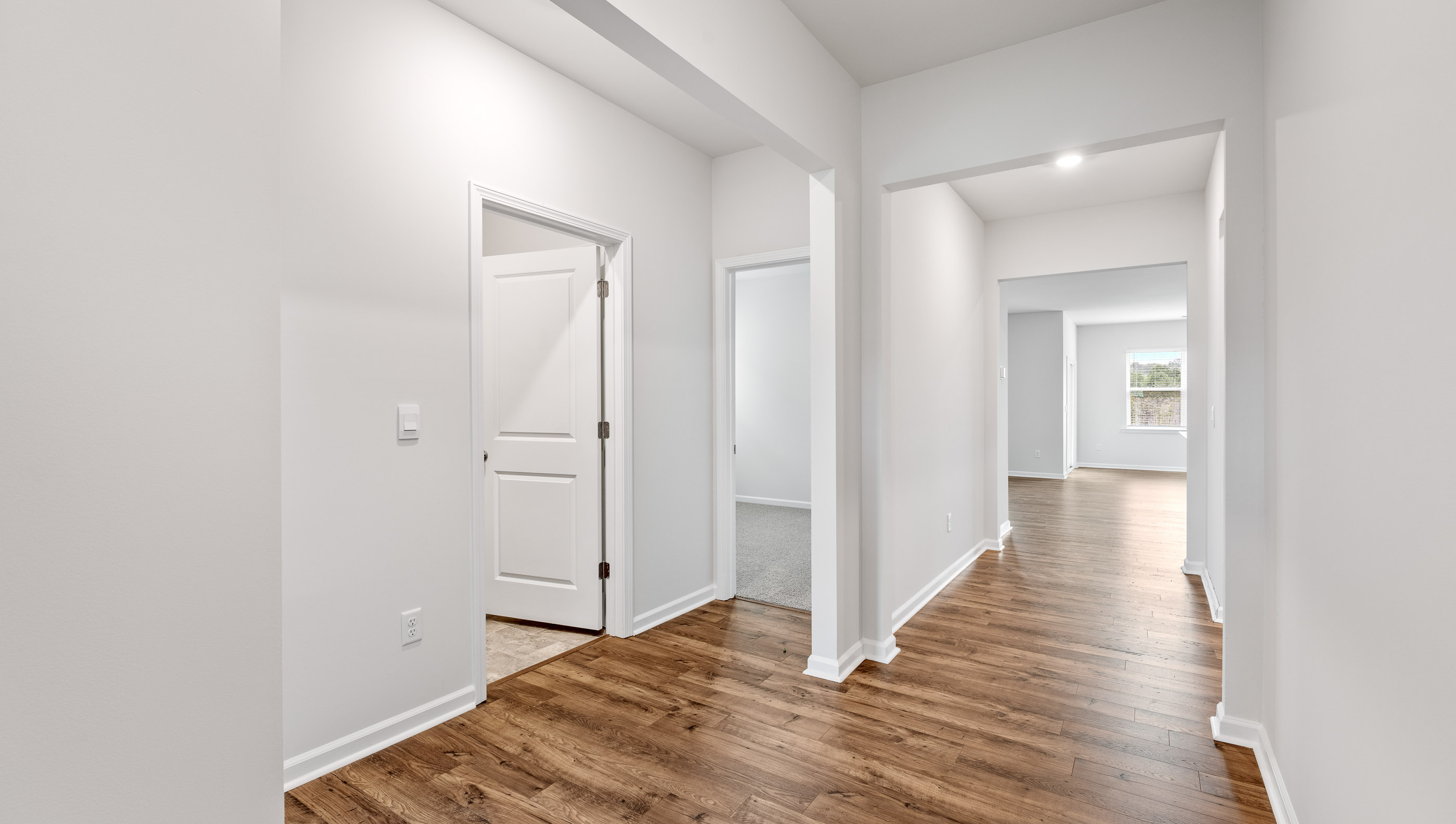 Entrance, foyer and view of front bedroom entrance.