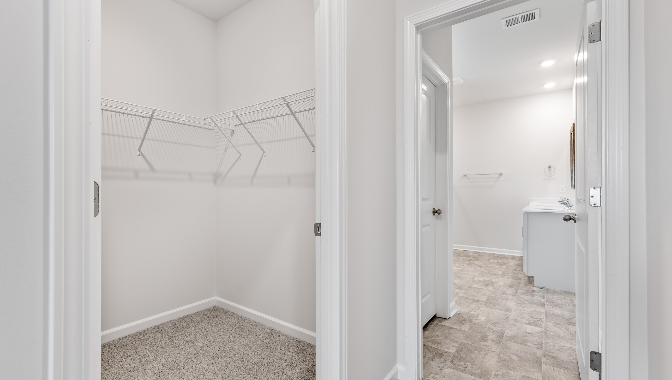 Primary bedroom walk in closet.