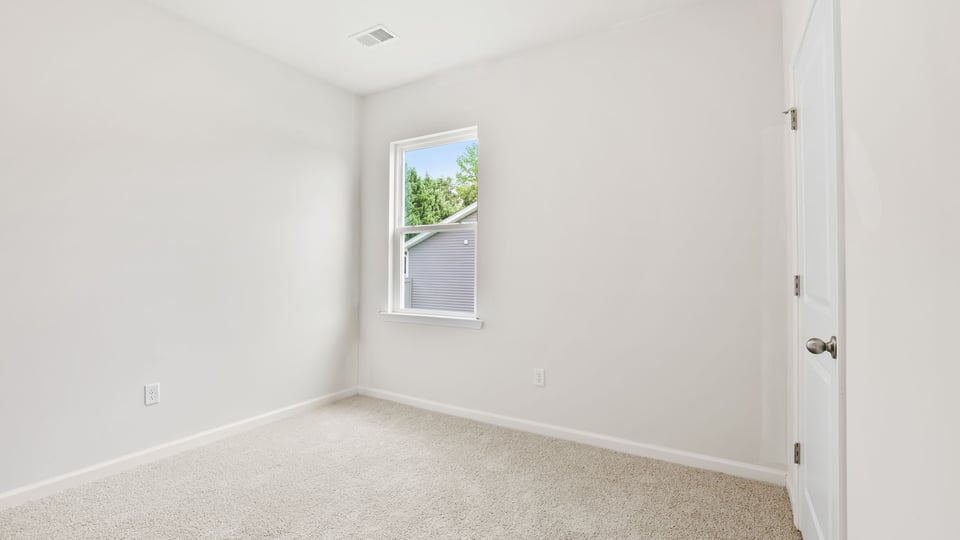 Bedroom with carpet.