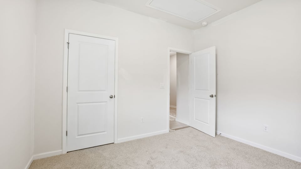 Bedroom with carpet.